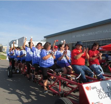 Members of the Sky family wear matching blue and white Tshirts as they ride the Heart  Stroke Big Bi