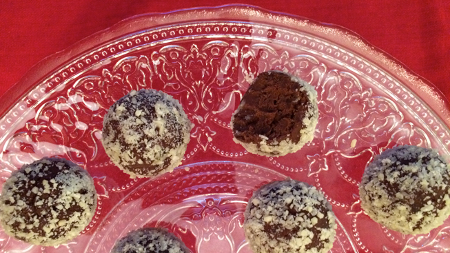 Chocolate almond bites on a clear plate